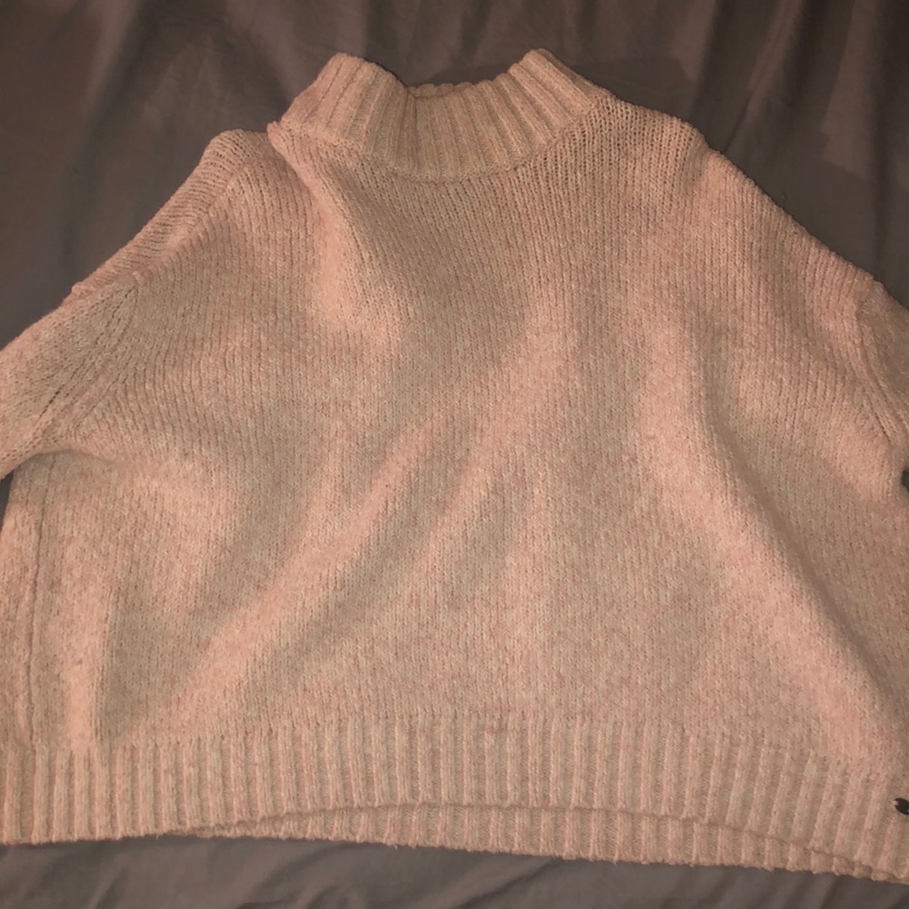 A light pink sweater
